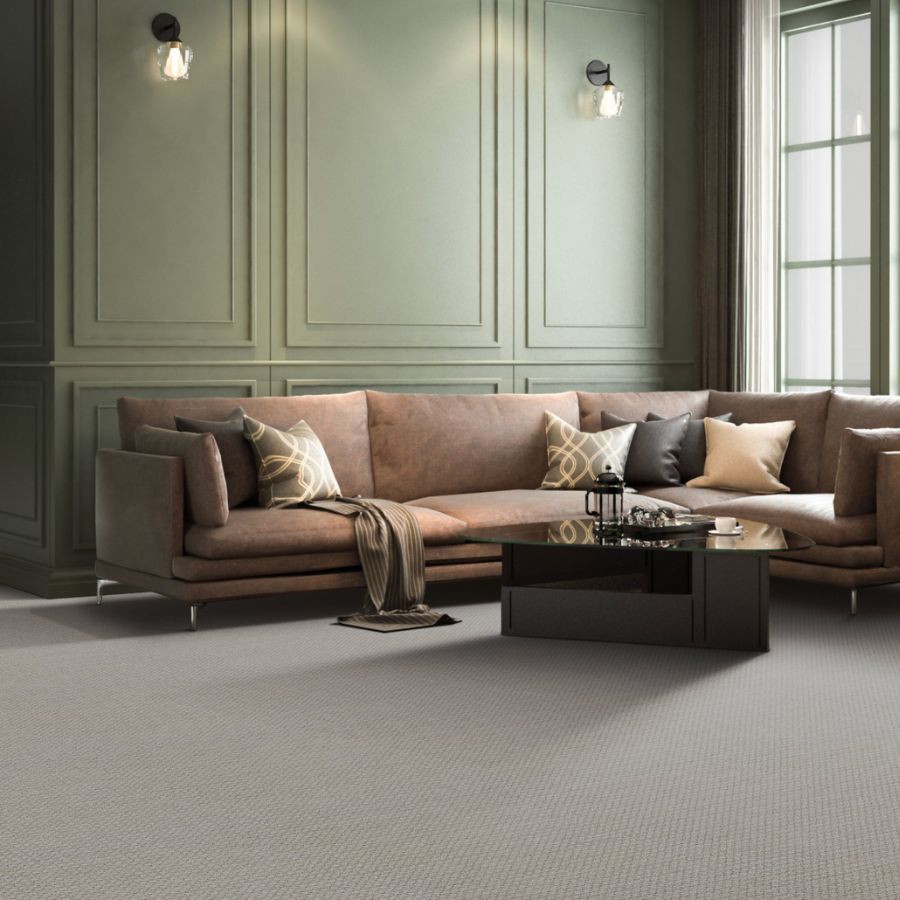 beige carpets in a living room with green accent wall and beige sectional